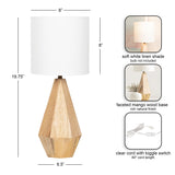 Table lamp with a faceted mango wood base in natural finish and a soft white linen shade, accompanied by a clear cord with toggle switch and dimension details.