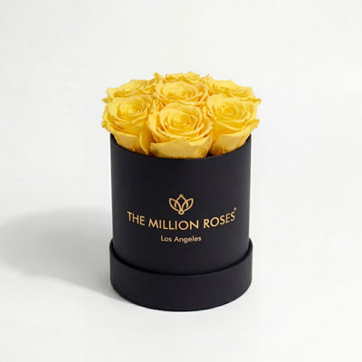 Essence Black Box with seven yellow roses in a minimalist black box