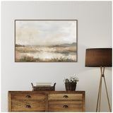 Neutral-toned abstract landscape painting with soft beige, brown, and gray hues, displayed above a wooden chest and next to a brown floor lamp.