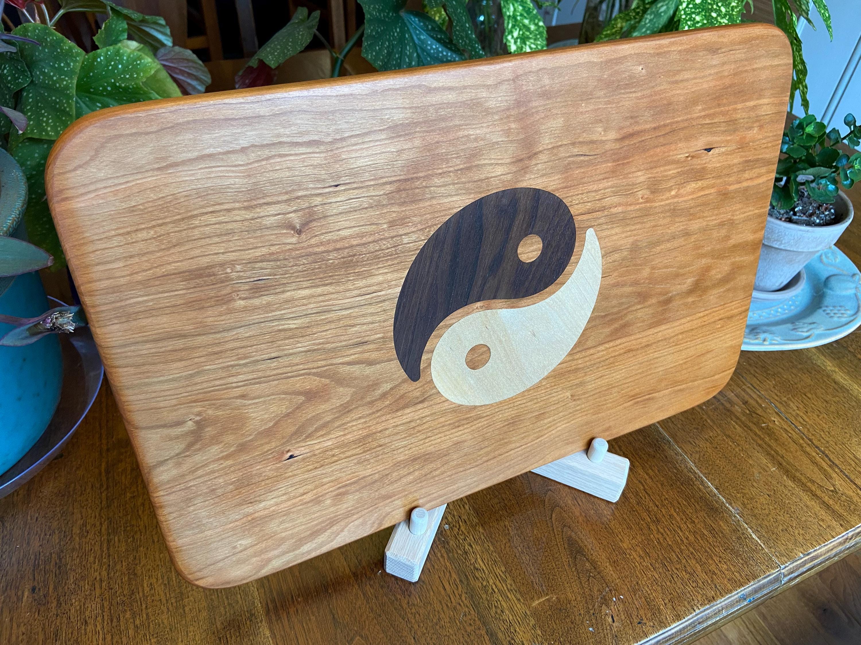 Cherry wood charcuterie board with Yin Yang inlay made from Peruvian walnut and maple