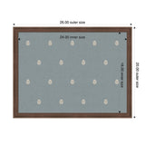 Rectangular pinboard with a brown wooden frame, blue fabric surface, and a pattern of small white botanical leaf motifs evenly spaced across.