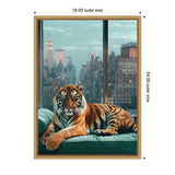 Tiger with orange and black stripes lounging on a teal couch with a nighttime city skyline featuring skyscrapers in the background, framed in natural wood.