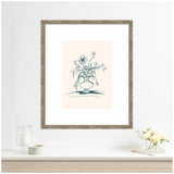 Framed line art drawing of summer flowers in a rounded vase with a light peach background, displayed above a white surface with candles and a small vase of white flowers.