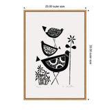 Black and white linocut art depicting three stylized birds with patterned bodies standing next to tall flowers, framed in a simple wooden frame.