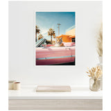 Framed print showing a tiger wearing sunglasses sitting in the driver's seat of a shiny pink classic convertible car with palm trees and blue sky in the background.
