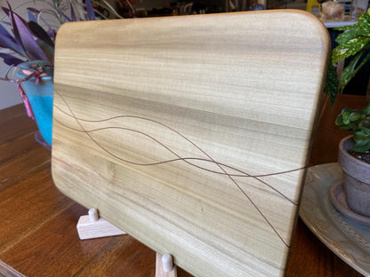 Handcrafted solid Poplar charcuterie board with Peruvian Walnut banding and inlay