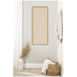 Vertical rectangular wall art with beige background and dark green lattice pattern, framed in light wood, displayed on a pale gray wall between white curtains and a wicker basket with a draped blanket.