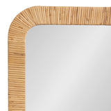 Close-up of a rectangular wall mirror corner with a rounded edge, featuring a frame made of tightly arranged, light brown natural cane sticks.