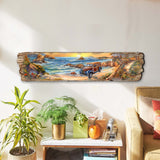 Long wooden wall art showing a coastal scene with waves, rocky cliffs, and a vintage woody car on a beachside road under a golden sky at sunset.