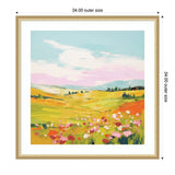 Framed colorful meadow landscape painting with yellow and orange fields, pink and white flowers, green trees, and a blue and pink sky with white clouds.