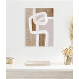 Abstract canvas art with interlocking white rhythmic lines over beige and light brown textured blocks, framed and hanging above a minimalist white desk with neutral decor.