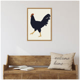 Framed minimalist print of a black rooster with red comb and yellow legs on a cream background, hanging above a rustic wooden bench with an open book and a beige pillow saying 'welcome home'.