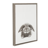 Framed canvas art of a gray and white fluffy bunny with floppy ears centered on a plain white background, shown at an angled view.