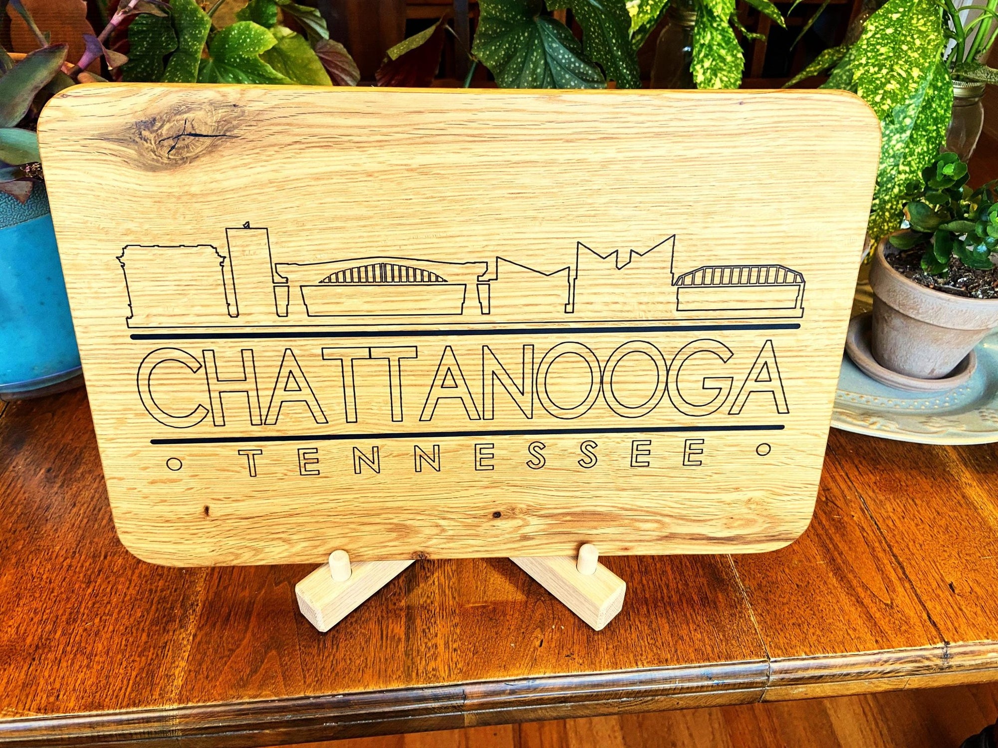 Handmade white oak charcuterie board with engraved Chattanooga skyline