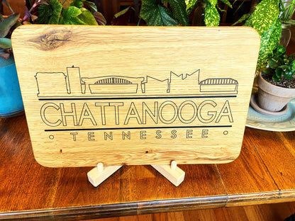 Handmade white oak charcuterie board with engraved Chattanooga skyline