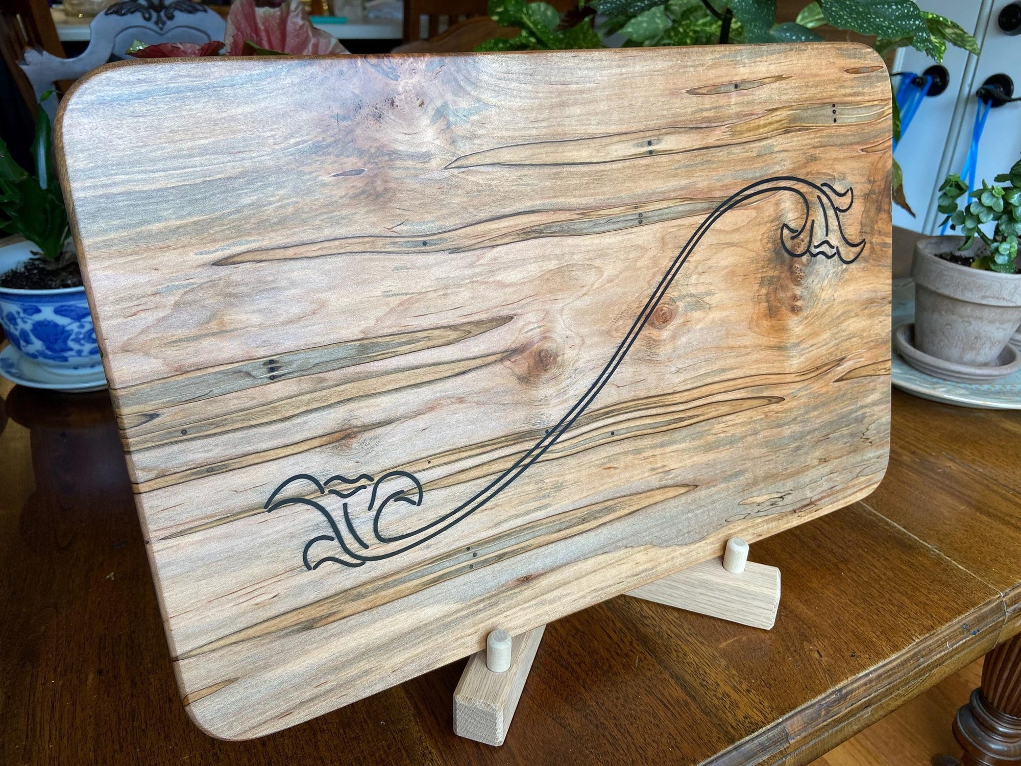 Ambrosia Maple charcuterie board with flower scroll resin inlay by Fitzgerald Custom Woodcraft