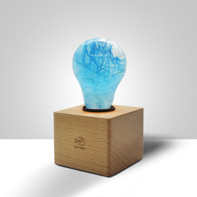 EP Light Memory Resin LED Bulb handcrafted with eco-friendly resin, shown with wooden base options