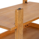 Close-up of a wooden rectangular coffee table corner showing a smooth wood grain surface, an adjustable black knob on a vertical support, and a lower wooden shelf.
