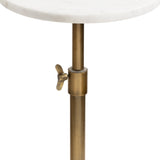 Detail of an adjustable brass-toned metal stand with a wingnut-style clamp supporting a round white marble tabletop with subtle grey veining.