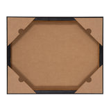 Back view of a rectangular black photo frame with four cardboard corner protectors on a plain white surface