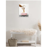 Framed canvas of mother and baby giraffe in pink bathtub on black-and-white checkerboard floor hanging above white bench with cream faux fur throw in minimalist room.