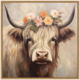 Portrait of a Highland cow with long cream and brown fur wearing a crown of soft pink, orange, and white flowers framed in light wood.