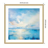 Framed abstract art depicting serene coastal waters with soft blue, white, and light orange tones blending under a cloudy sky, sized 34 by 34 inches outer frame.