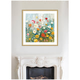Square framed painting of a colorful wildflower garden with red, yellow, white, and pink blooms against a muted blue-green background, hanging above an ornate white fireplace.