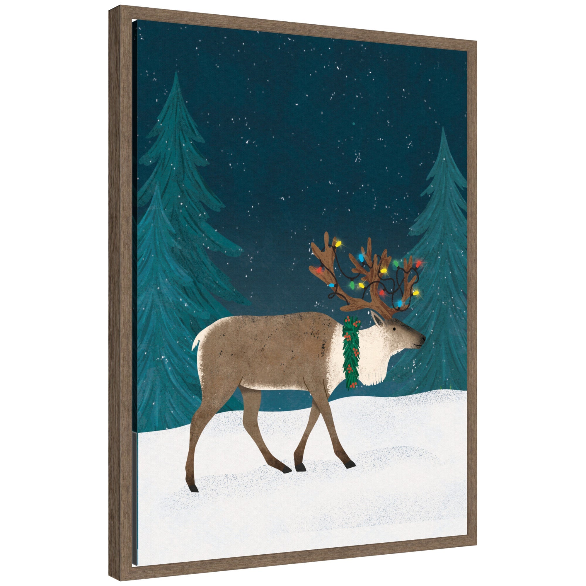 Framed canvas art showing a Christmas caribou with festive lights on antlers standing in a snowy forest at night