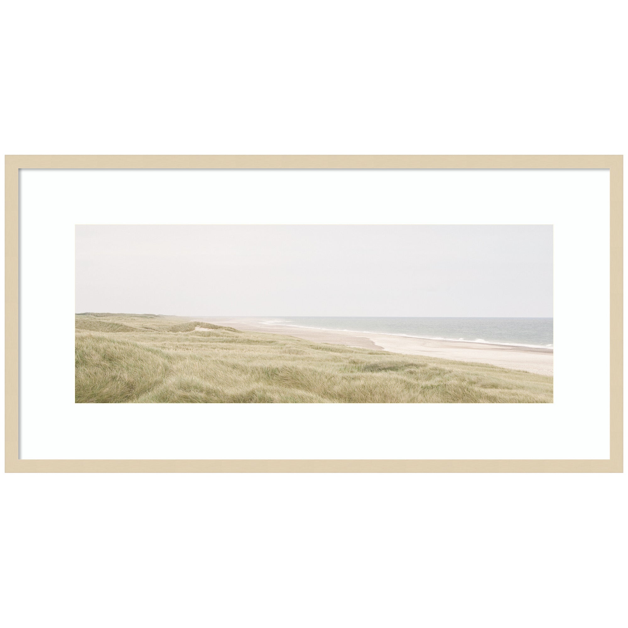 Framed coastal landscape art print showing a tranquil shoreline with boats and hills in muted colors