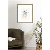 Rustic wood-framed line drawing of wildflowers in a vase on a soft peach background, hung on a white wall above an olive-green curved armchair and potted leafy plant.