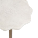 White scalloped marble table top with subtle gray veining, supported by a slender bronze metal leg, shown in a close-up view.