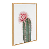 Framed canvas art featuring a green cactus with vertical ridges and pink spines topped by a soft pink blooming flower, set against a white background.