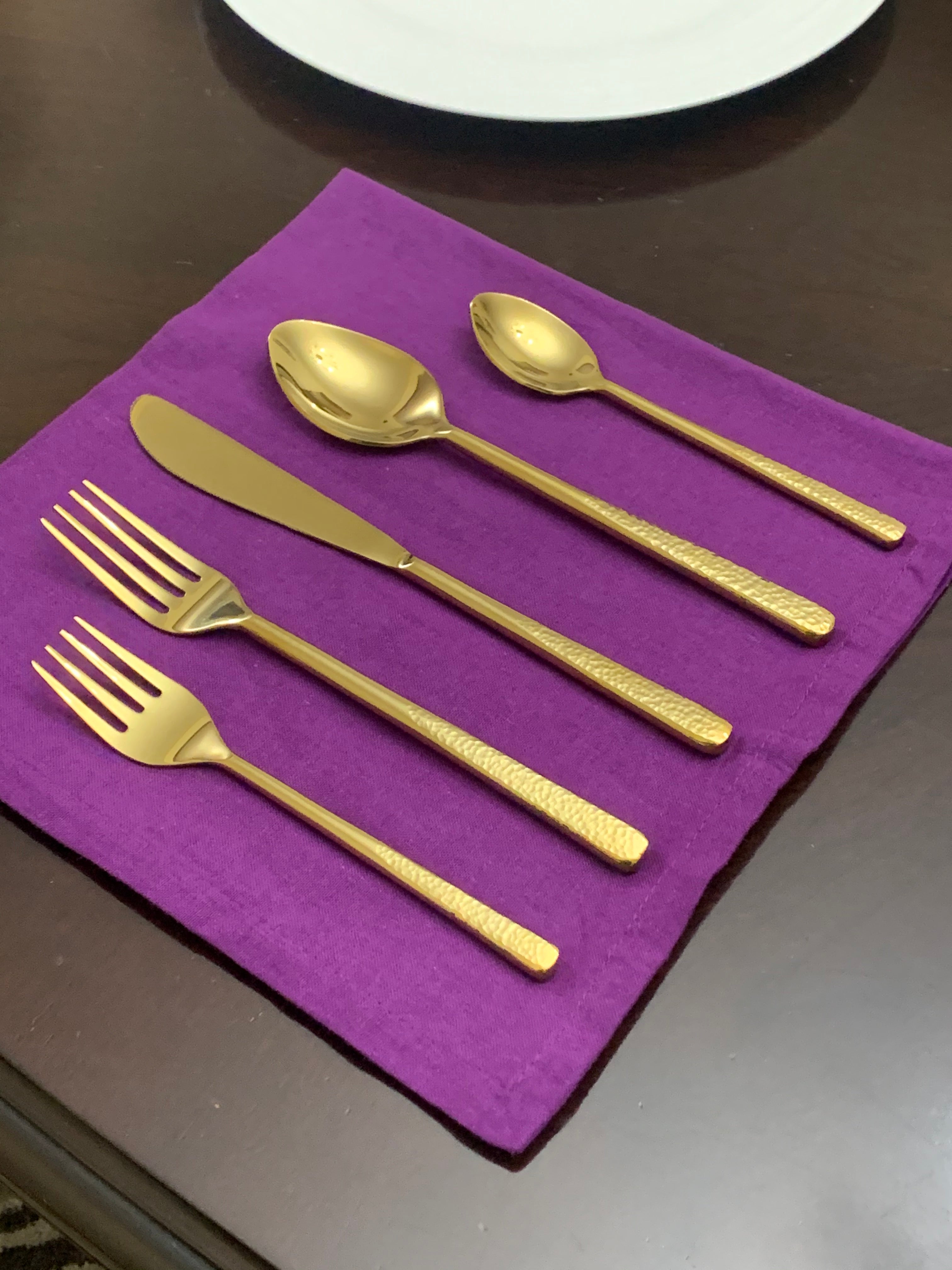 Vibhsa 20 Piece Gold Flatware Set displayed on table with golden sheen