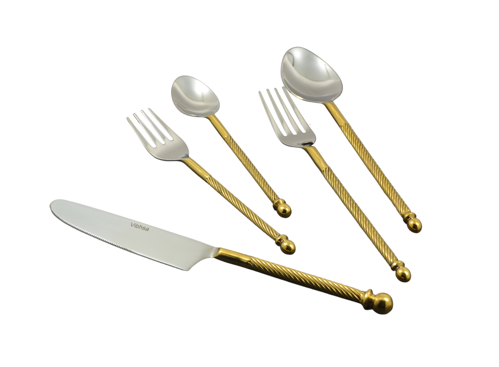 Golden stainless steel flatware set of 20 pieces with swirled handles laid out on table