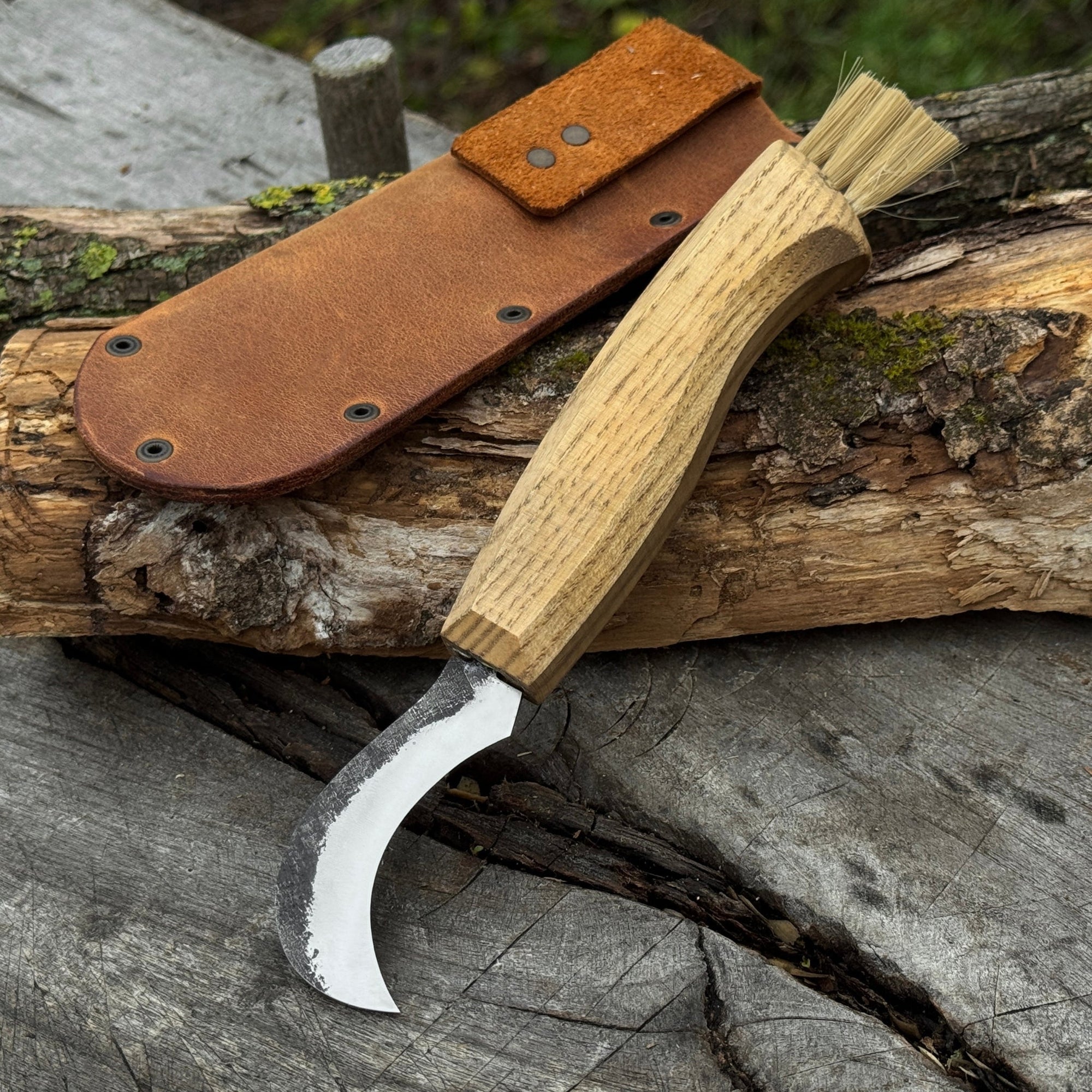 Forged mushroom knife with 6.5 cm carbon steel blade, ash wood handle, and built-in brush by Sharky Forged Steel Tools