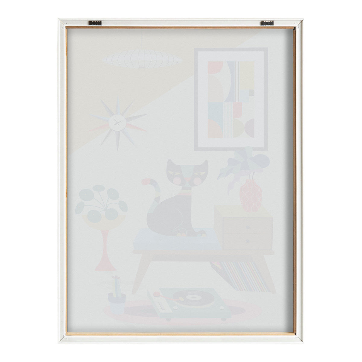 Framed print showing a gray and white cat sitting on a blue bench beside a record player and plant, with modern abstract wall art and a starburst clock above.