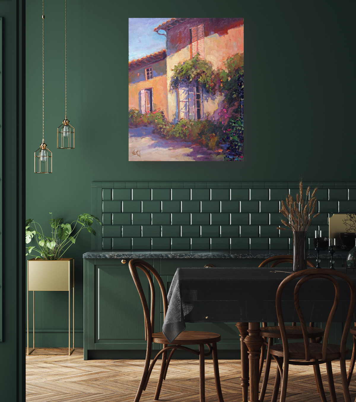 Impressionist painting of a sunlit rustic building with leafy green vines and pink flowers, displayed above a dark green dining area with bentwood chairs and pendant lights.