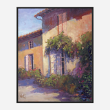 Sunlit painted facade of a rustic house with open shutters, painted in warm yellows and purples, complemented by lush green vines and pink flowers beneath a clear blue sky.