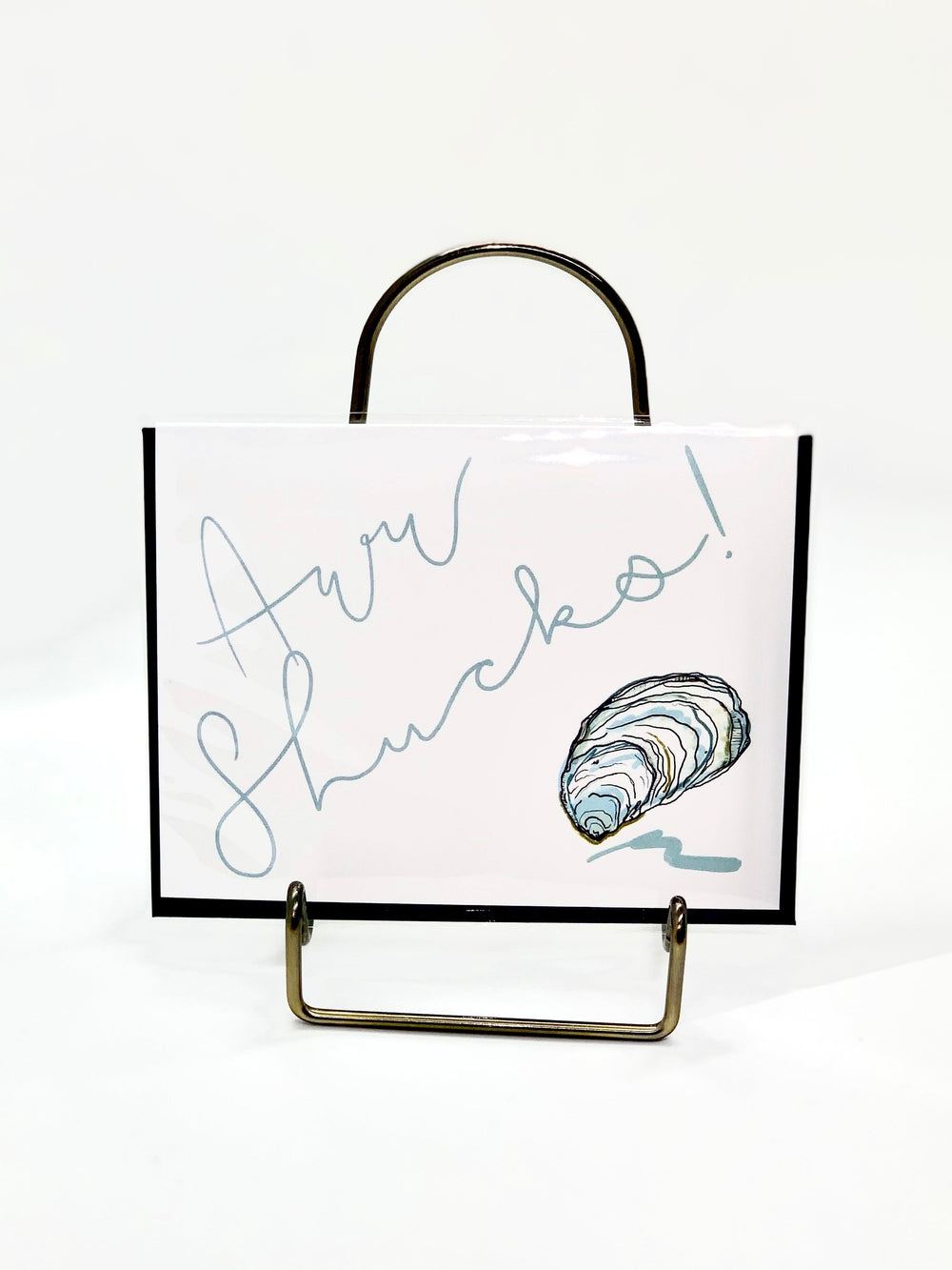 Aww Shucks Greeting Card showing an illustrated coastal shell design on the front with blank interior
