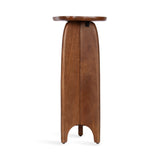 Side view of a tall, narrow wooden side table with smooth rounded top and three tapered legs joined at a curved base panel, showing warm natural wood grain.