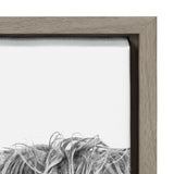 Close-up of the upper left corner of a framed canvas showing textured brushstrokes in grey and white, with a natural wood frame.