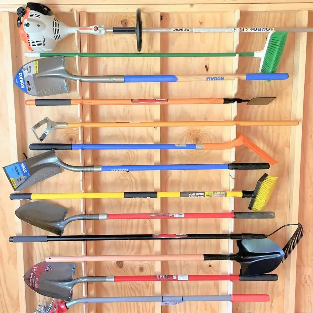 Stud-mounted Garden Tool Organizer Rack holding various garden tools in a shed