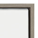 Close-up of a blank white canvas tightly stretched in a beige wooden frame with a smooth, matte finish showing clean corner joinery.