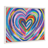 Multicolored concentric heart shapes radiating outward on a canvas, featuring vibrant stripes, dots, and patterns in a white decorative frame.