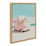 Framed canvas showing a pink vintage van on a sandy beach with two giraffes peeking from inside, accompanied by pink balloons against a blue sky.