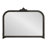 Arched rectangular wall mirror with a dark ornate frame featuring beaded detailing and a decorative crest at the top center.