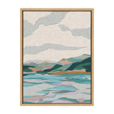 Abstract landscape painting with layered teal, green, beige, and mauve shapes depicting hills and water beneath a cloudy sky, framed in light wood.