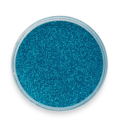 Blue glitter in a round container on a white background
