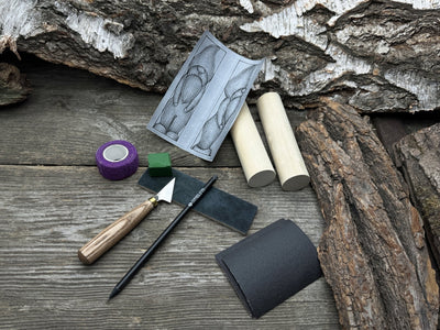 Complete Gnome Carving Kit with knife, wooden blocks, sandpaper, sharpening board, pencil, and gnome drawing template